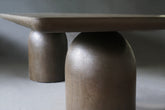 Close-up view of Nexus Dining Table in Pebble finish, highlighting its minimalist design.